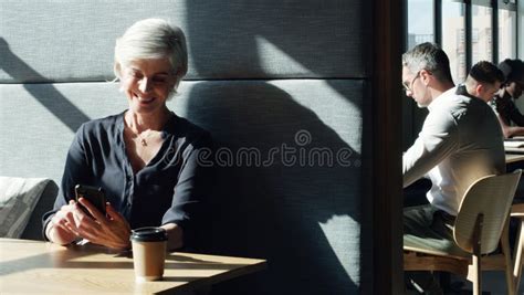 Connectivity Keeps The Good News Coming A Mature Businesswoman Using A