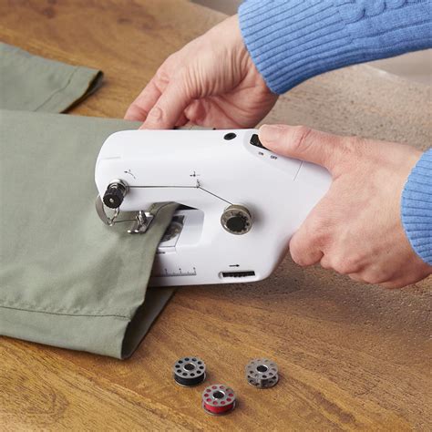 The Cordless Handheld Sewing Machine - Hammacher Schlemmer