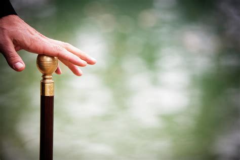 A Hand Holding A Walking Cane Photograph by Ron Koeberer - Pixels