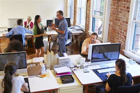 Busy Design Office With Workers At Desks — Stock Photo © Monkeybusiness