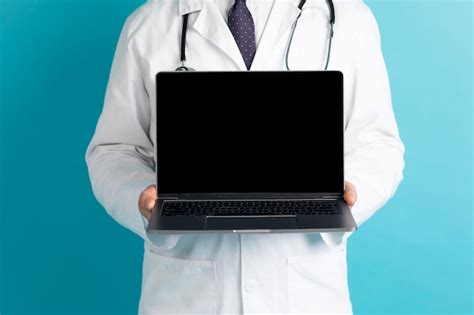 Premium Photo Cropped Of Doctor Showing Laptop With Black Screen