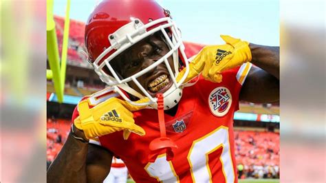 Tyreek Hill Is Showing Golden Teeth Wearing Red Sports Dress And Helmet