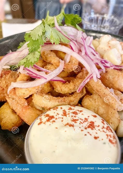 Delicious Plate Of Fried Calamari On A Plate In A Restaurant Stock