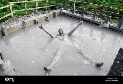 Traveller Getting Covered In Mud While Enjoying The Mud Baths Of