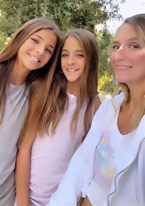 Three Girls Are Posing For A Photo Together