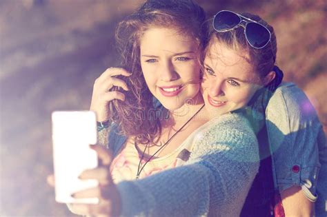 Capturing Best Friend Moments Two Teenage Girls Taking A Selfie