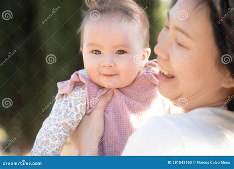 Pure Joy As A Young Asian Korean Mother Lovingly Plays With Her Little