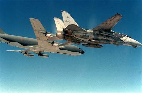 A Fighter Squadron 84 Vf 84 F 14a Tomcat Aircraft Flies Beside An Air