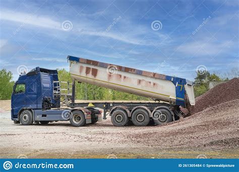 A Dump Truck Delivers Building Material To Stock Photo - Image of ...