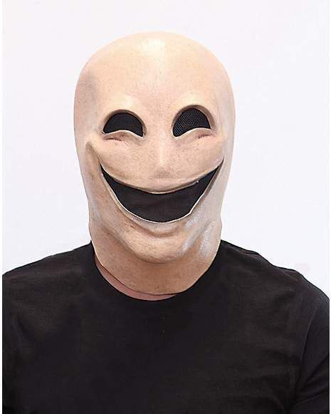 A Man Wearing A White Mask With A Smile On It S Face And Black T Shirt