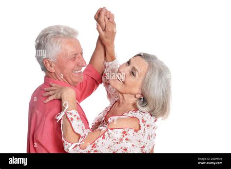 Portrait Of Happy Senior Couple Dancing Isolated On White Background