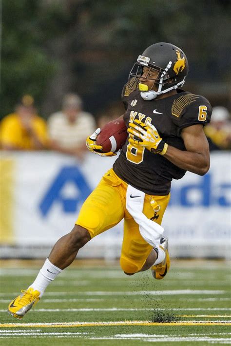 2013 Wyoming Brown On Gold Uniform With Matte Helmet Wyoming Football