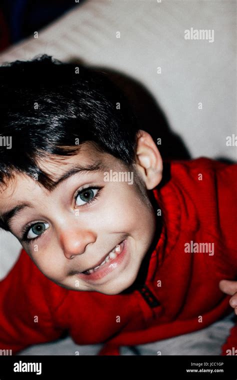 Boy With Green Eyes Smiling Stock Photo Alamy