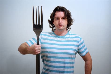 Man With Big Fork As A Neptune Trident Stock Image Image Of Cutlery