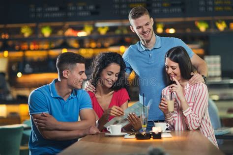 Friends Having Coffee in Cafe Stock Photo - Image of meeting, smile ...