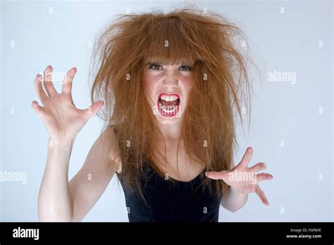 Woman With Messy Tangled Long Brown Hair About To Fight Screaming Stock