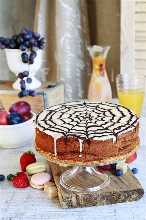 Halloween Chocolate Spider Web Cake And Various Fruits Around Stock