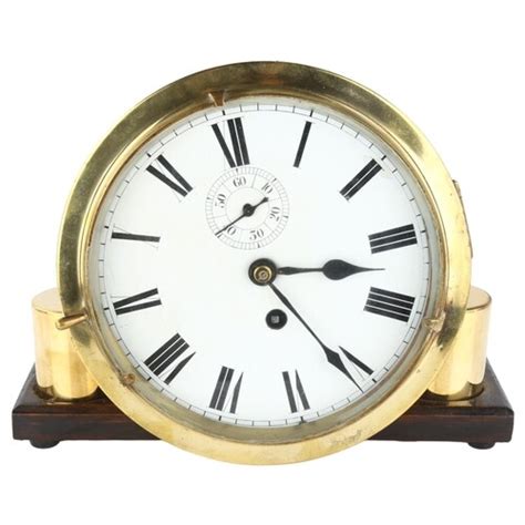 An Antique Brass Ship S Bulkhead Clock White Enamel Dial Wi In