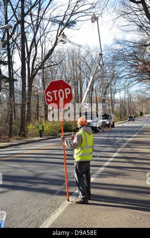 Construction Worker Holding Stop Sign On Road Stock Photo Alamy