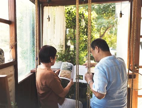 Premium Photo Happy Black Couple Reading A Book At Home