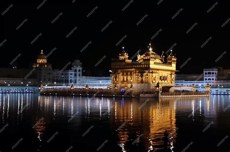 Premium AI Image | The golden temple at night with lights on