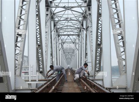 The bridge of Indian Railways in Bihar, and railway workers working on ...