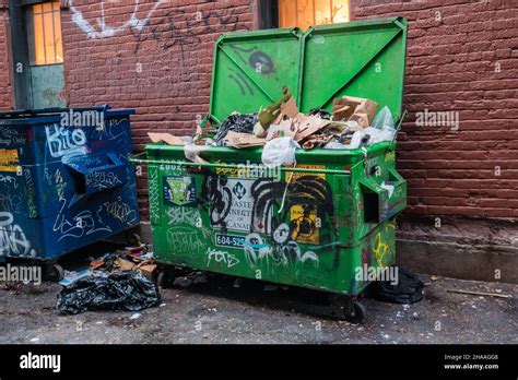 Garbage In A Dumpster Back Alley Vancouver Canada Stock Photo Alamy