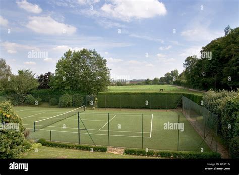 Uk A Garden With A Private Tennis Court Stock Photo Alamy
