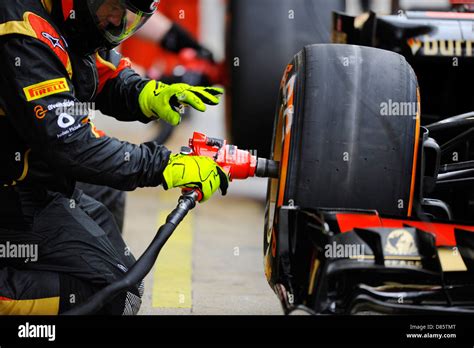 Mechanic Changes Tire During The Spanish Formula One Grand Prix Race