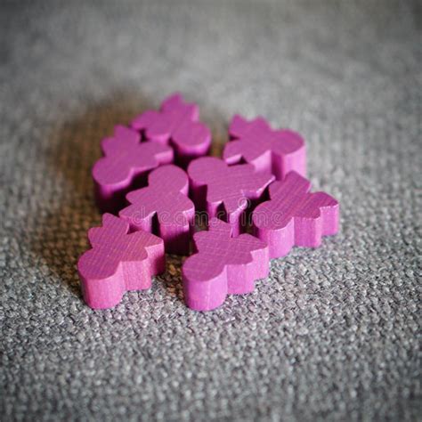 Closeup of Wooden Purple Play Figures of the Carcassonne Card and Board ...