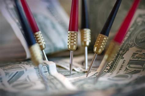 Premium Photo Close Up Of Paper Currency And Darts