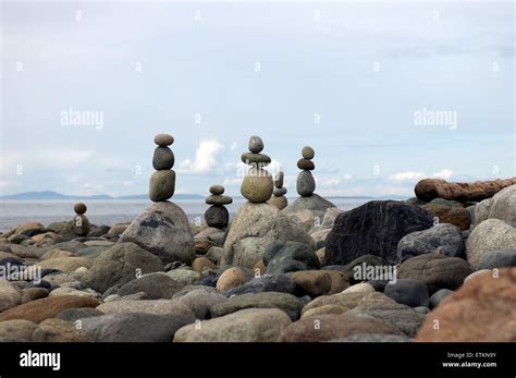 Stacked and balanced beach rocks Stock Photo - Alamy