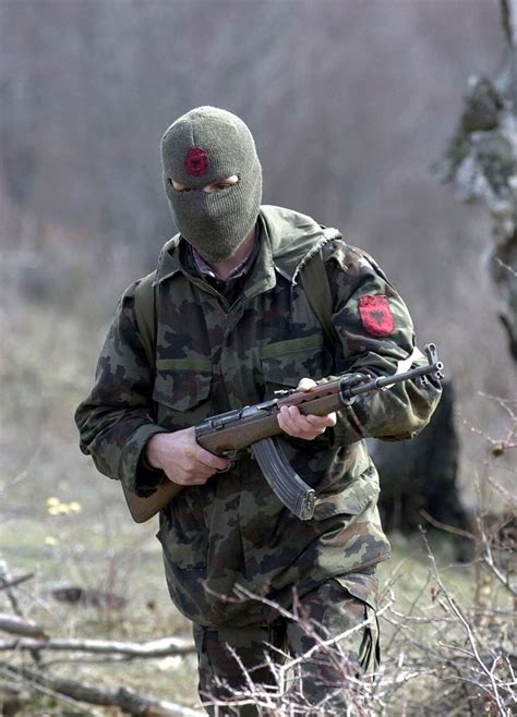 A member of the Kosovo Liberation Army (KLA) armed with a variant of ...