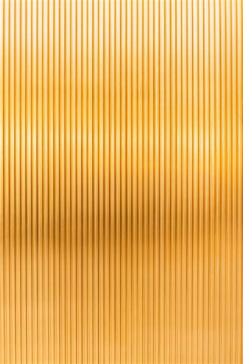 A gold metallic background with vertical lines photo – Free Pattern ...