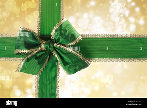 Green Bow And Ribbon With Gold Bokeh Lights Background Stock Photo Alamy