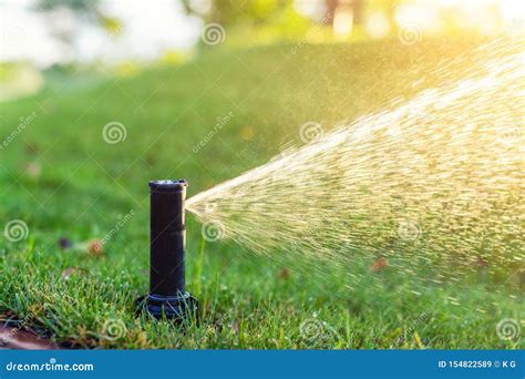 Close Up Automatic Garden Watering System With Different Sprinklers