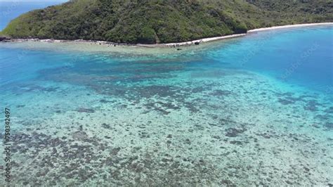 Descending top down aerial of coral reefs: one of the most fascinating, complex and biologically ...