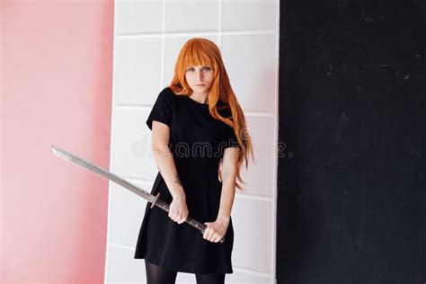 Portrait of a Beautiful Girl with a Japanese Sword Cosplayer Anime ...