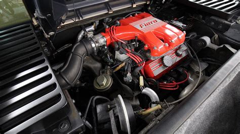 1987 Pontiac Fiero GT – engine bay 001 – Duncan Imports – gold – driver ...