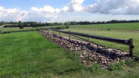 Handling runoff from solid agricultural source material storages and