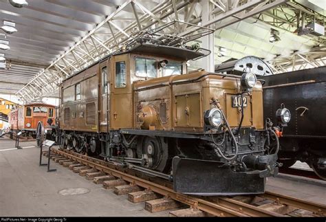 An Old Train Is On Display In A Museum