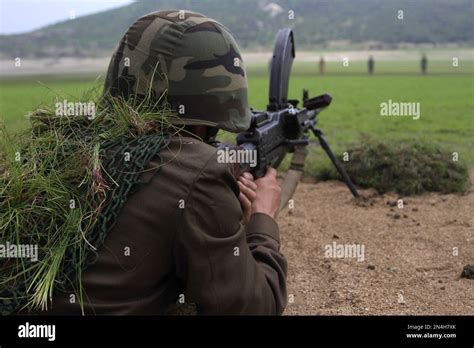 A Korean Peoples Army Kpa Soldier Aims His Weapon Before Firing