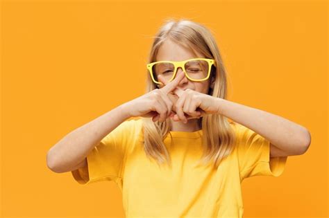 Premium Photo Portrait Of Woman Wearing Sunglasses Against Yellow Background