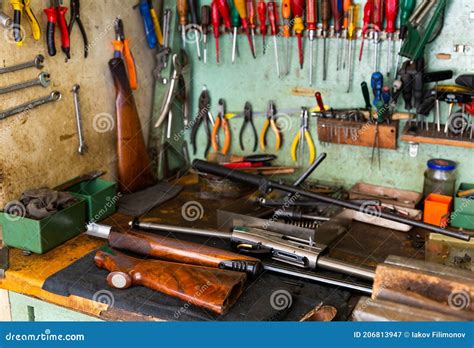 Workplace of Gunsmith in Weapons Workshop with Tools and Disassembled ...