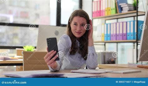 Beautiful Woman Takes Selfie On Smartphone Working In Office And Takes