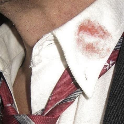 A Man Wearing A Tie With Red Spots On It