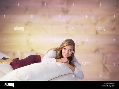 Composite Image Of Pretty Blonde Relaxing On The Couch Stock Photo Alamy