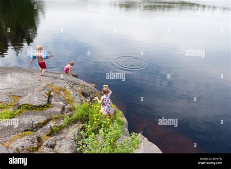 Kids swimming in a small lake, Espoo, Finland Stock Photo - Alamy