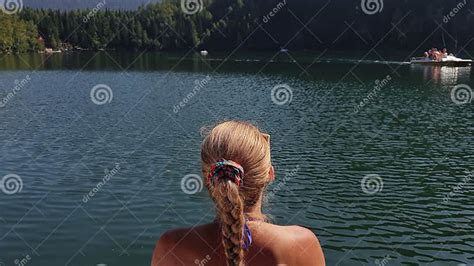 Woman Sit On A Sunbed In Sunglasses And Swimming Suit Girl Rest On A