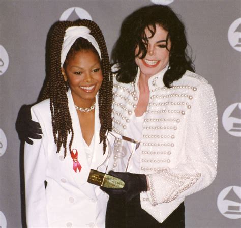 Michael Jackson and Janet Jackson pose for photos in the green room at the 35th Annual Grammy ...